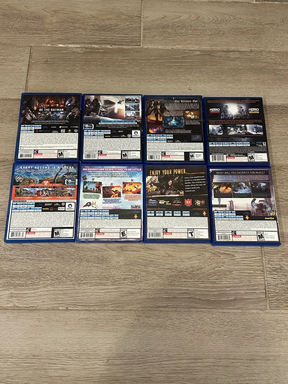 PlayStation 4 Video Games Lot (8) (Watch Dogs, Metro Redux, Batman, Far Cry 4)